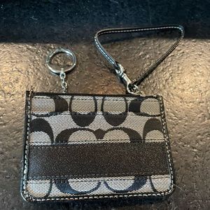 Coach signature collection grey and black mini wristlet.